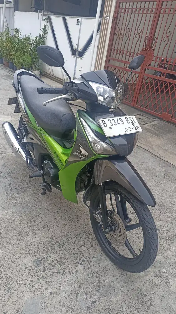 Honda Supra X 125 F1 helm in tahun 2013.