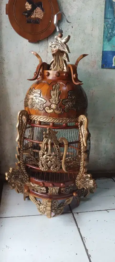 Sangkar ukir nogo Sosro terbuat dari kayu jati TPK