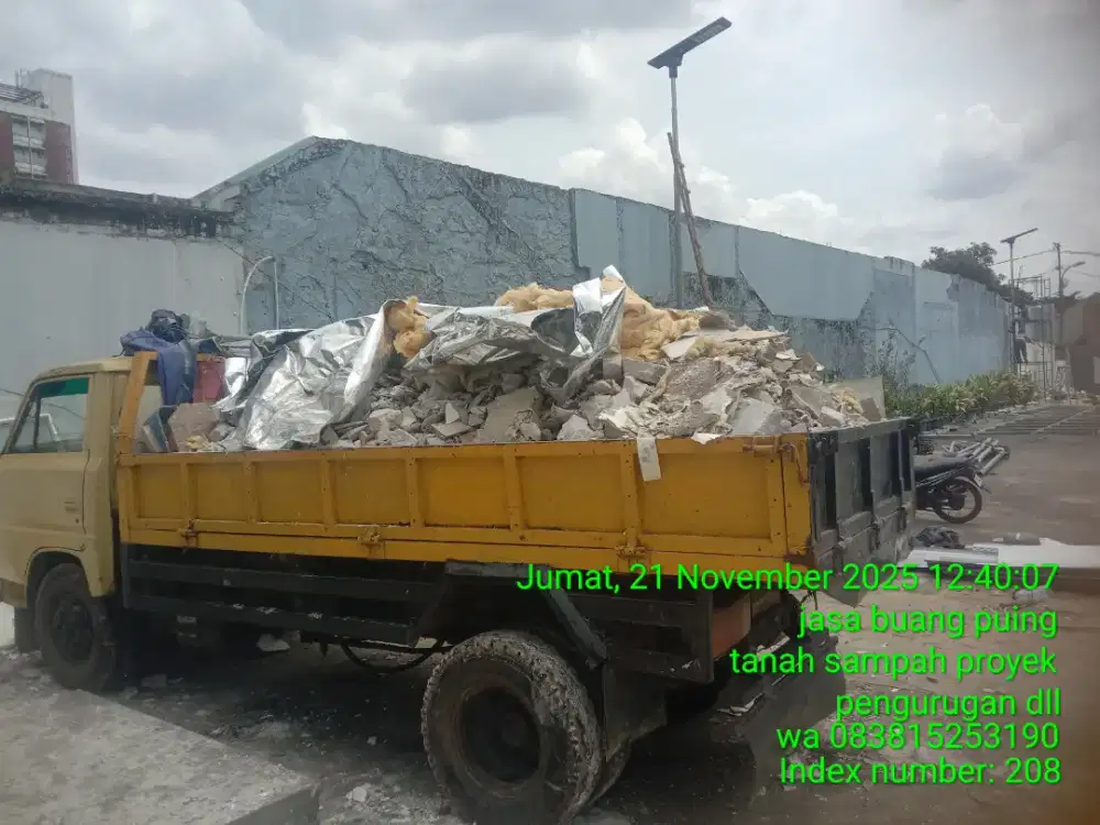 Tukang buang puing sampah dll