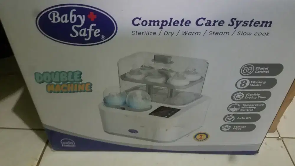 Alat penghangat botol susu