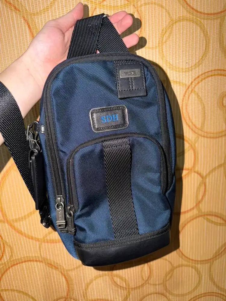 Tumi fife slim sling bags