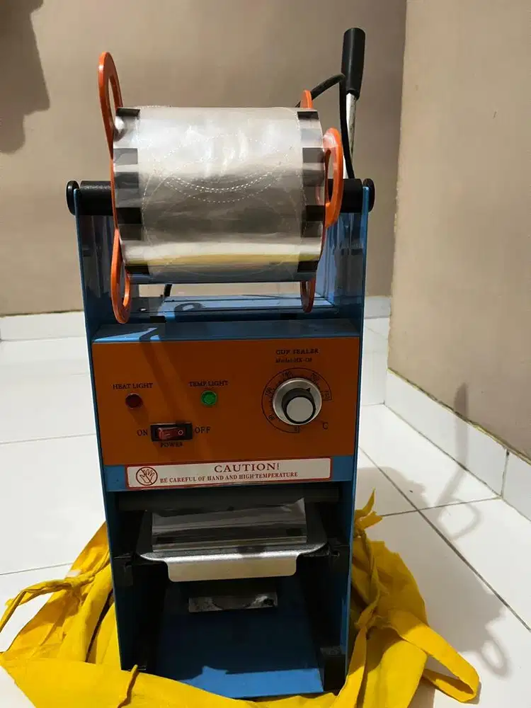 Mesin cup sealer press