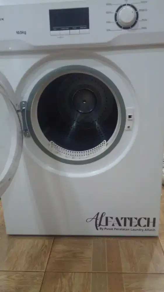 Mesin dryer atau pengering pakaian