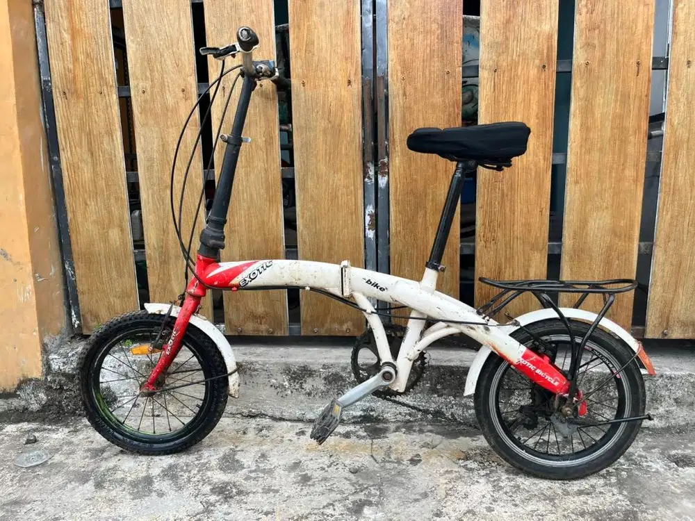 Sepeda lipat seli exotic UK 16 putih merah normal