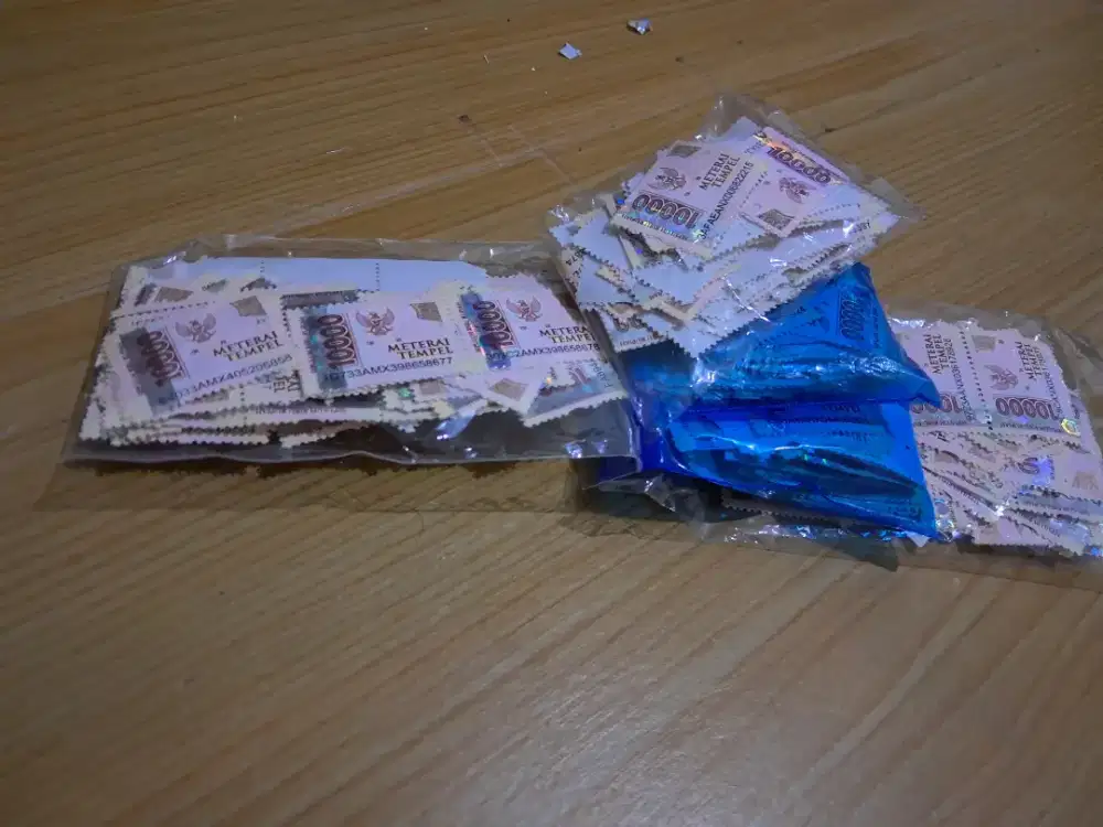 MATERAI 10000 bekas layak pakai