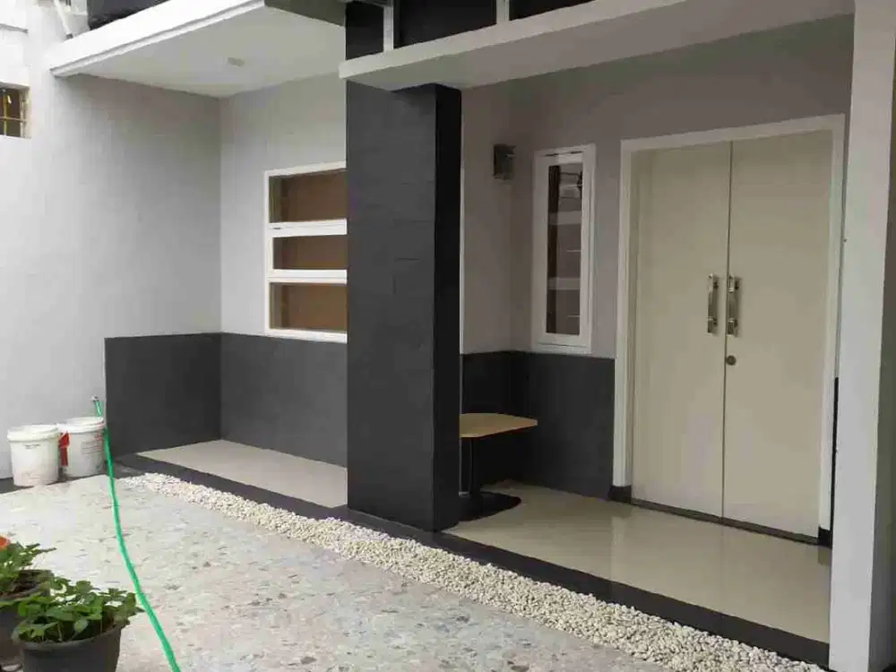 Rumah cakep n cozy lebar muka 9m dan carport 2 mobil di TCI