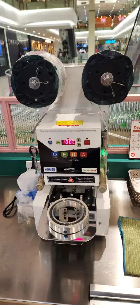 Mesin penyegel gelas minuman atau mesin sealing otomatis