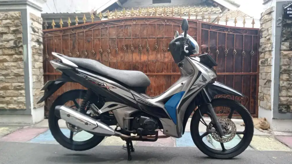 supra x 125 fi helm in 2013 mesin bagus body mulus