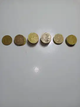 Uang koin 100,- karapan sapi