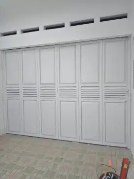 Pintu garasi sleding lipat besi handerson