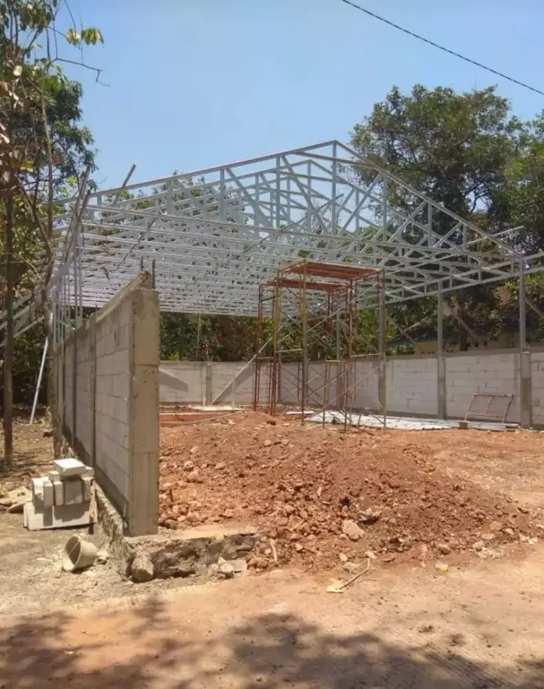 Renovasi atap baja ringan TASO dengan genteng metal/spandek