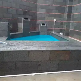 Tukang pasang batu alam