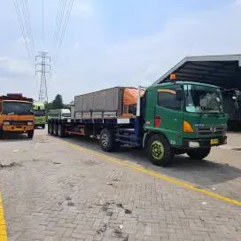 Sewa truk trailer harian atau bulanan