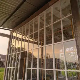 Pintu Lipat Kaca Aluminium Partisi Kaca Tempered Frameless Jogja