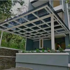 Canopy tiang gawang atap transparan rangka tunggal modern