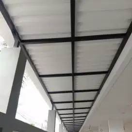 Kanopi dengan rangka besi holo atap alderon