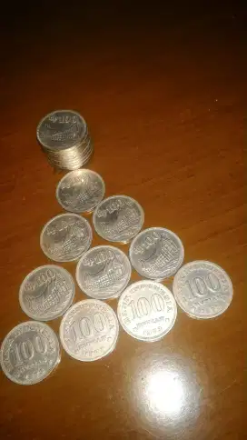 Uang koin logam Rp.100 tebal, rumah adat Padang